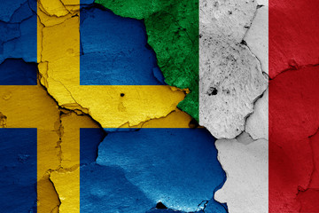flags of Sweden and Italy painted on cracked wall