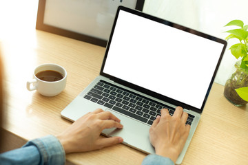 Fototapeta premium mockup image blank screen computer,cell phone with white background for advertising text,hand man using laptop texting mobile contact business search information on desk in office.marketing and design