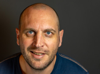 Obraz premium portrait of bald man with blue eyes