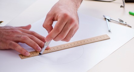 Architect working in his studio on new project