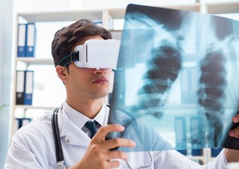 Doctor working with virtual VR reality glasses
