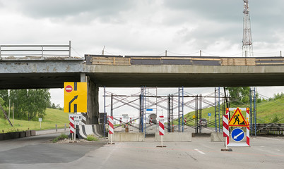 Road signs, detour, repair of the road on the paved road on the highway