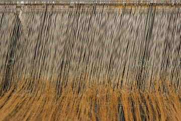 Threads in the hand powered weaving loom