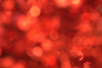Red bokeh lights background, unfocused full frame image with room for text.