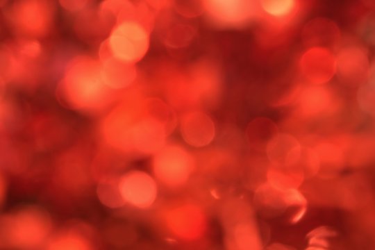 Red bokeh lights background, unfocused full frame image with room for text. - Powered by Adobe
