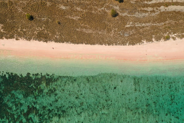 Aerial view of Tropical long or pink beach in Komodo National Park, East Nusa Tenggara, Indonesia.