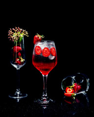 cocktail in glass with strawberry slices