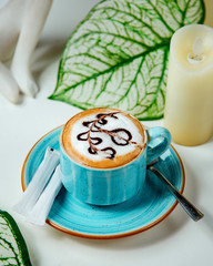 coffee with whipped cream and chocolate drawing