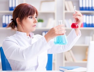 Female scientist researcher conducting an experiment in a labora