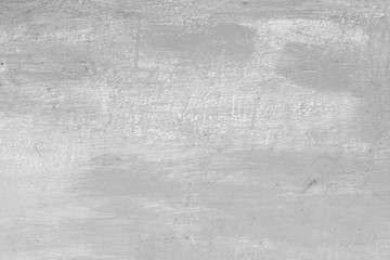 Texture of a concrete wall with cracks and scratches which can be used as a background