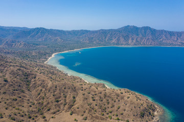 Aerial view of typical village on small island in Komodo National Park, Nusa Tenggara, Indonesia. Komodo National Park is home to about 3500 people.