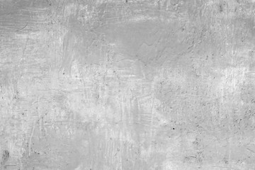 Texture of a concrete wall with cracks and scratches which can be used as a background
