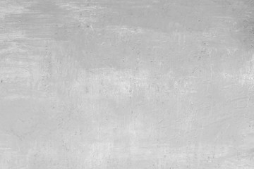 Fototapeta premium Texture of a concrete wall with cracks and scratches which can be used as a background