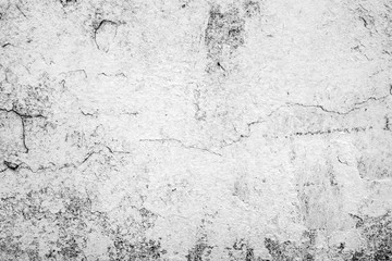 Texture of a concrete wall with cracks and scratches which can be used as a background