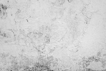 Texture of a concrete wall with cracks and scratches which can be used as a background