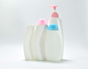 White plastic bottle For lotion, body lotion on a white background.
