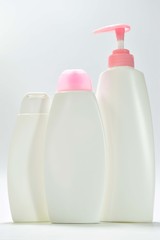 White plastic bottle For lotion, body lotion on a white background.