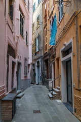 Fototapeta na wymiar VERNAZZA / ITALY - JULY 2015: Narrow street in the old Vernazza village, Cinque Terre, Italy
