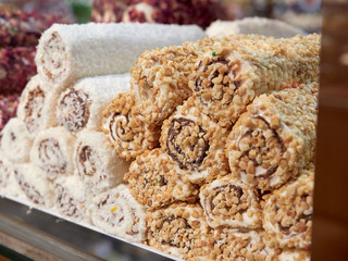 Turkish delight for dessert. Lokum dish with different flavors on sale in Istanbul food store.Traditional sweet locum with sugar for snack