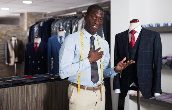 Designer is creating business image with red tie