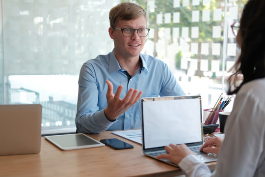 business people discussing on performance revenue in meeting. businessman working with businesswoman.