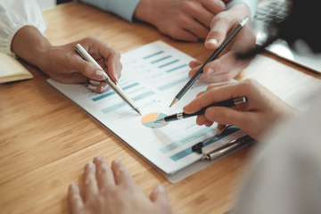 business people discussing on performance revenue in meeting. businessman working with businesswoman.