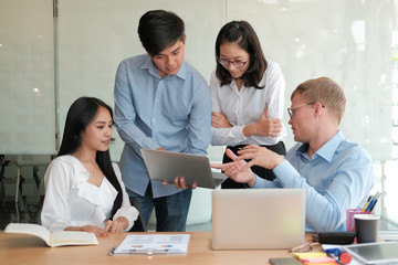 Fototapeta premium business people discussing on performance revenue in meeting. businessman working with businesswoman.