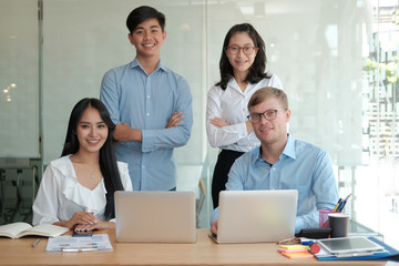 asian executive businessman businesswoman man woman smiling at workplace. business  team