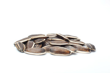 Processed sunflowers seeds isolated on white background with clipping path