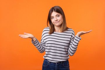 Don't know! Portrait of uncertain confused brunette woman in long sleeve shirt standing having...