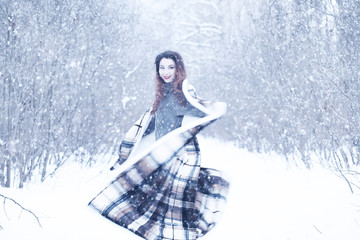 Beautiful girl in a beautiful winter snow