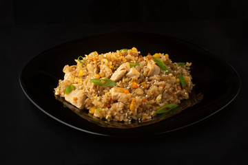 Chinese rice with herbs, carrots, corn and chicken