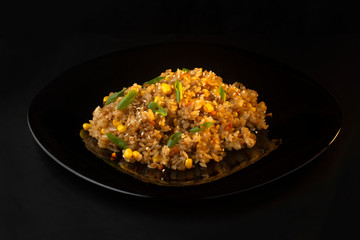 Chinese rice with green onions, carrots and corn