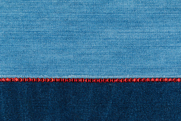 Denim is embellished with a line of red rhinestones. Text place, copy space.