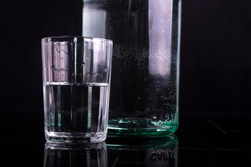 still life with a glass bottle and a glass