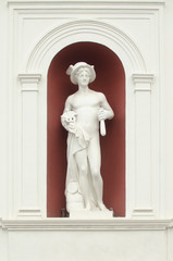 Hermes statue on the facade of the building