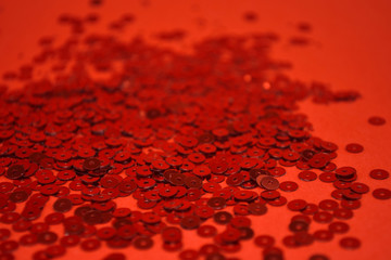 Red sparkles on red background. Celebratory Background. Red Explosion Of Confetti.
