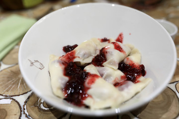 Dumplings with Cherry Jam in bowl