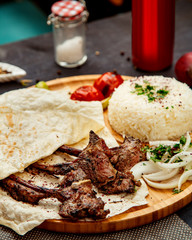 fried lamb ribs with lavash and rice