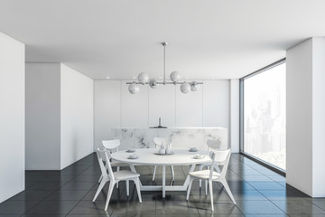 White marble kitchen and dining room interior