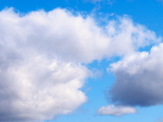 White clouds on a blue sky background