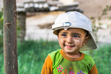 Happy boy smiling with cap