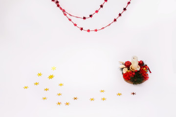 Christmas candle on white background, red beads, Christmas