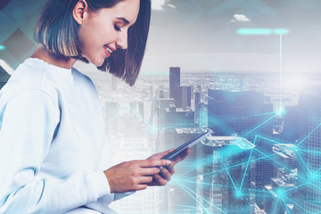 Smiling woman with tablet in city, network
