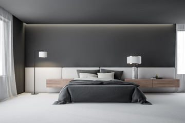 Gray master bedroom interior with lamp