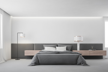 White master bedroom interior with lamp