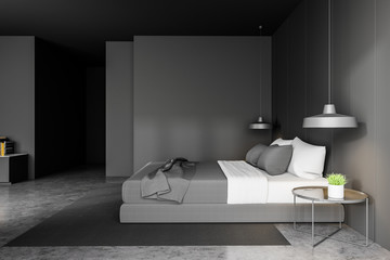 Gray master bedroom with round table