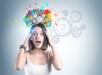 Shocked young casual woman brainstorming