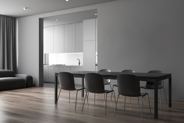 Gray dining room and kitchen with sofa