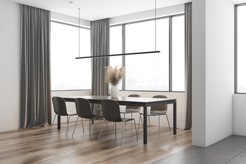 White dining room corner with curtains